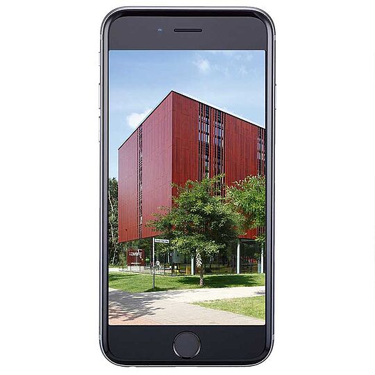 A black mobile phone with a wallpaper of the 7THINGS - my basic hotel